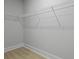 Empty walk-in closet space with white wire shelving system at 202 Bilge Rd, Ridgeville, SC 29472