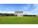 Large backyard with screened porch. Perfect new construction property for outdoor activities at 203 Bilge Rd, Ridgeville, SC 29472