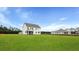 New construction home boasts expansive lawn and charming screened porch, perfect for outdoor enjoyment at 203 Bilge Rd, Ridgeville, SC 29472