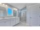 Bright bathroom featuring double vanity, tile floors, and a glass-enclosed shower at 203 Bilge Rd, Ridgeville, SC 29472