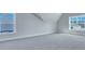 Large, bright bedroom with light gray carpet and two windows at 203 Bilge Rd, Ridgeville, SC 29472