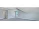 A bright room with high ceilings, light carpet and one window at 203 Bilge Rd, Ridgeville, SC 29472