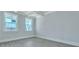 Spacious bedroom featuring hardwood floors, light paint and windows with white trim for plenty of natural light at 203 Bilge Rd, Ridgeville, SC 29472