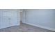 Bright bedroom features wood grain floors, a closet, neutral walls, and white trim at 203 Bilge Rd, Ridgeville, SC 29472