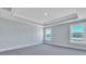 Large bright bedroom with 2 windows and light gray carpet at 203 Bilge Rd, Ridgeville, SC 29472