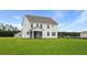 Spacious new construction home with lush lawn and screened in porch for outdoor living at 203 Bilge Rd, Ridgeville, SC 29472