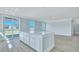 Spacious kitchen with a white island, wood floors, and access to an outdoor area at 203 Bilge Rd, Ridgeville, SC 29472