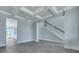 Spacious living room with coffered ceiling, view of dining area, staircase with white railing, and hardwood floors at 203 Bilge Rd, Ridgeville, SC 29472