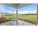 Covered screened porch with views of backyard and blue skies provides relaxation and additional living space at 203 Bilge Rd, Ridgeville, SC 29472