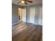 Bedroom with three large closets and wood-look flooring at 203 Oakmont Ave # B, Ladson, SC 29456
