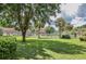 Grassy community lawn area features mature shade trees and tropical palms at 203 Oakmont Ave # B, Ladson, SC 29456