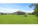 Spacious backyard with lush green grass and a modern-style home in a Gathering-friendly neighborhood at 206 Bilge Rd, Ridgeville, SC 29472