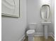 Powder room featuring a modern sink, toilet and light wood flooring at 206 Bilge Rd, Ridgeville, SC 29472