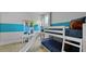 Bedroom featuring a white bunk bed with a slide feature and light colored wood floors at 206 Bilge Rd, Ridgeville, SC 29472