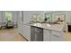 Modern kitchen featuring an island with bar seating, stainless steel appliances, and an open floor plan at 206 Bilge Rd, Ridgeville, SC 29472