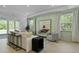 Inviting living room featuring lots of natural light, neutral decor, and access to the outdoors at 206 Bilge Rd, Ridgeville, SC 29472