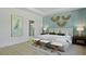 Main bedroom featuring a decorative accent wall with a bed between two nightstands at 206 Bilge Rd, Ridgeville, SC 29472