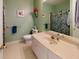 Bathroom showcases a vanity, framed mirror, toilet, and vibrant shower curtain at 2071 Middleburg Ln, Mount Pleasant, SC 29464