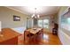 Dining room with hardwood floors, neutral walls, and ample natural light from large window at 2071 Middleburg Ln, Mount Pleasant, SC 29464