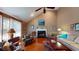 Bright living room featuring vaulted ceiling, hardwood floors and fireplace at 2071 Middleburg Ln, Mount Pleasant, SC 29464