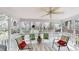 Screened-in porch with comfortable seating provides a relaxing outdoor living area at 2071 Middleburg Ln, Mount Pleasant, SC 29464
