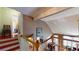 Bright staircase landing with wood floors and open railing to downstairs living areas at 2071 Middleburg Ln, Mount Pleasant, SC 29464