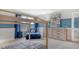 Cozy bedroom is adorned with charming decor, a whimsical bed frame, and a comfortable blue lounge chair at 210 Bilge Rd, Ridgeville, SC 29472