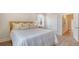 Cozy bedroom with white bedding, soft pillows, and natural light with easy access to the ensuite bathroom at 210 Bilge Rd, Ridgeville, SC 29472