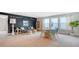 Large bonus room with seating area, dining set, chalkboard wall, and plenty of natural light at 210 Bilge Rd, Ridgeville, SC 29472