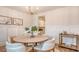Elegant dining room featuring stylish decor, a modern chandelier, and comfortable seating at 210 Bilge Rd, Ridgeville, SC 29472