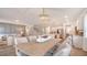 Open dining room with a view of the living room and kitchen area at 210 Bilge Rd, Ridgeville, SC 29472