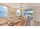 Elegant dining room featuring a wooden table, chandelier, and natural light at 210 Bilge Rd, Ridgeville, SC 29472