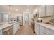 Bright kitchen with stainless steel appliances, white cabinetry, and quartz countertops at 210 Bilge Rd, Ridgeville, SC 29472