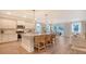 Open kitchen with stainless steel appliances and a large island with breakfast bar at 210 Bilge Rd, Ridgeville, SC 29472