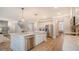 Open kitchen with stainless steel appliances and a large island with quartz countertops at 210 Bilge Rd, Ridgeville, SC 29472