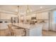 Bright kitchen with stainless appliances, large island, pendant lights, and hardwood floors at 210 Bilge Rd, Ridgeville, SC 29472