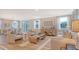 Open-concept living room with stylish furniture and plenty of natural light at 210 Bilge Rd, Ridgeville, SC 29472