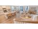 A spacious open-concept living space merges kitchen, dining, and living areas under abundant natural light at 210 Bilge Rd, Ridgeville, SC 29472