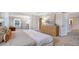 The spacious main bedroom features large windows and a sitting area for a relaxing retreat at 210 Bilge Rd, Ridgeville, SC 29472