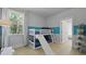 Playful bedroom with bunk beds, slide, a window, and natural light at 212 Bilge Rd, Ridgeville, SC 29472