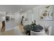 Bright dining area with a round table near the kitchen with stainless steel appliances at 212 Bilge Rd, Ridgeville, SC 29472
