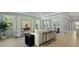 Open-concept living room features ample seating, modern décor and large windows at 212 Bilge Rd, Ridgeville, SC 29472