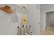 Welcoming mudroom features a bench, shelf with hooks, and a view into the hallway at 212 Bilge Rd, Ridgeville, SC 29472