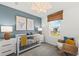 A Bedroom with a crib, rocking chair, and neutral decor at 213 West Bradford Pointe Dr, Summerville, SC 29486