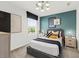 A cozy bedroom with a queen bed, black and white decor, and bedside tables at 213 West Bradford Pointe Dr, Summerville, SC 29486