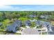 Aerial view of homes in a neighborhood featuring a pond, mature trees, and well-maintained lawns at 215 Center Hill Ct, Summerville, SC 29485