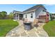 Backyard with a stone patio, fire pit, chairs, and a cozy outdoor space at 215 Center Hill Ct, Summerville, SC 29485