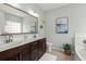 Elegant bathroom featuring double vanity, decorative mirror, and modern fixtures at 215 Center Hill Ct, Summerville, SC 29485