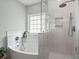 Modern bathroom with soaking tub, glass shower, and beautiful tile at 215 Center Hill Ct, Summerville, SC 29485