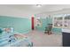 ' bedroom with bright color accents, two windows, and cheerful decor at 215 Center Hill Ct, Summerville, SC 29485